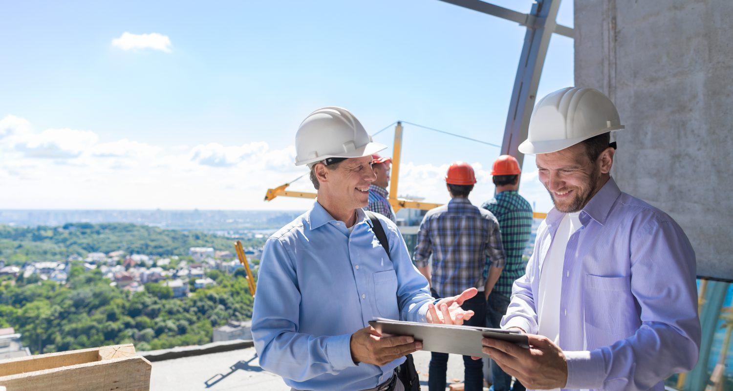 Architect Explain Project Plan To Builder Contractor On Constuction Site